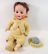 A bisque headed composition doll with cry voice box - a/f, eyes loose, open mouth with teeth and red