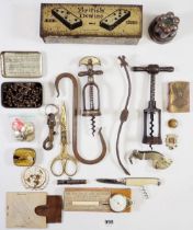 A box of collectables including dominoes, corkscrews, copper aspic mould etc.