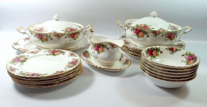 A Royal Albert Country Roses dinner service comprising large gravy boat and stand, seven dinner