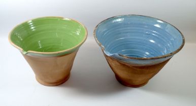 Two terracotta glazed mixing bowls, 35 and 29cm diameter