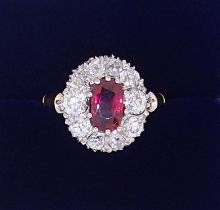 A fine 18ct gold ruby and diamond oval cluster ring, the ruby 7mm x 4mm approx., size M, 4.8g