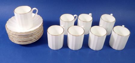 A set of eight Worcester white coffee cups and saucers