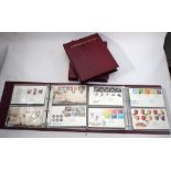 Four Royal Mint albums with over 240 purposed first day covers of definitive and commemorative