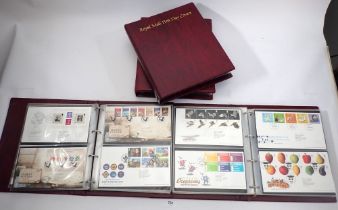 Four Royal Mint albums with over 240 purposed first day covers of definitive and commemorative