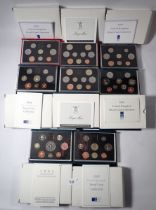 Eight Royal Mint proof coin sets, 1889 and 1990 deluxe in red leather cases, 1989, 1990, 1992, 1993,