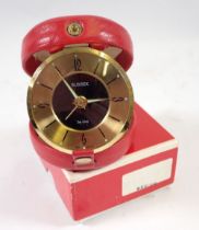 A Sussex De Luxe vintage travel clock in original red leather case