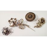 A Swedish silver flower form brooch by Ge-Ka Smycken, a sterling silver circular brooch and two
