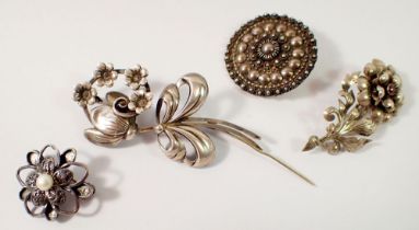 A Swedish silver flower form brooch by Ge-Ka Smycken, a sterling silver circular brooch and two