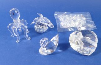 A group of Swarovski glass ornaments: heart - 5cm, swan with bag of hearts, dolphin with bowl,