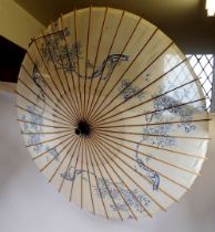 A Japanese bamboo and silk parasol painted blue flowers, 86cm