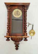 A Vienna style mahogany wall clock with Art Nouveau embossed dial, pendulum and key, 63cm