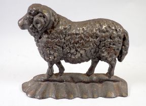 A cast iron lamb form fire dog, 19cm tall