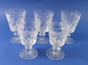 A set of five cut glass bucket form wine glasses