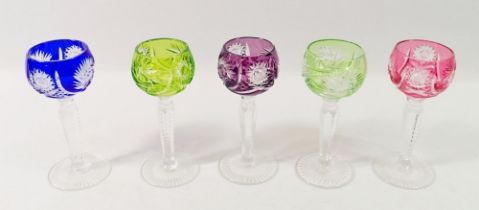 A set of five harlequin cut liquor glasses