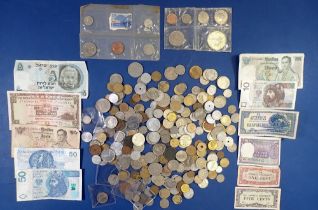 A group of 20th & 21st century world coins with a bundle of banknotes, Australia, Eire, Japan,