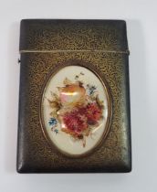 A 19th century lacquered bone card case inset oval mother of pearl floral painted panel