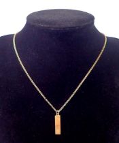A 9 carat gold miniature diamond set ingot 2.2cm on 9 carat gold chain, 4.2g 38cm long