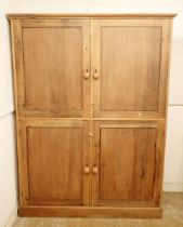 A Victorian large pine kitchen or housekeepers cupboard with two pairs of panelled doors, 158cm wide