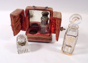 A 19th century glass smelling salts bottle with silver plated and turquoise bead lid in fitted stand