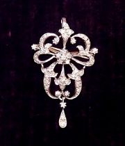 A white metal diamond set openwork pendant/brooch in Bell Epoque style, 4.5cm