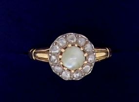 An antique unmarked gold ring set diamond and pale green stone cluster, size P, tested as 18ct gold