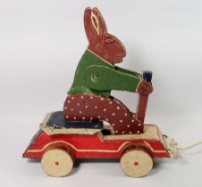 An early 20th century wooden pull along rabbit toy, 30cm long