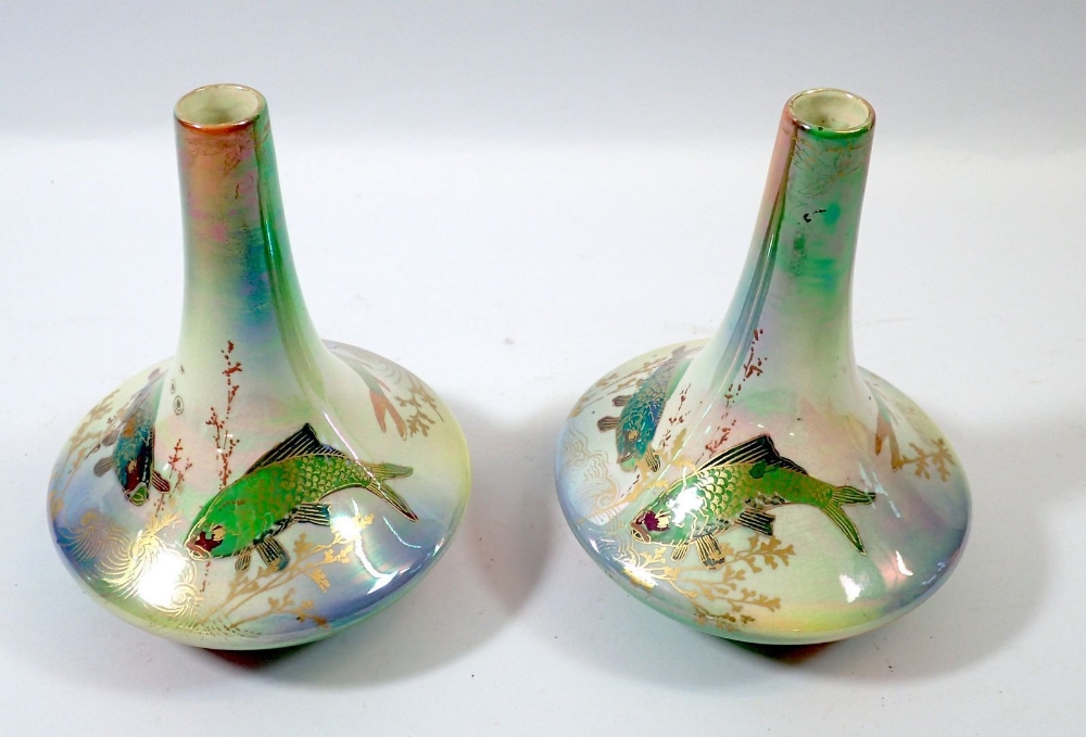 A pair of Devon Lustre Ware vases by Fieldings decorated fish, 16cm tall