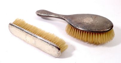 Two silver backed brushes