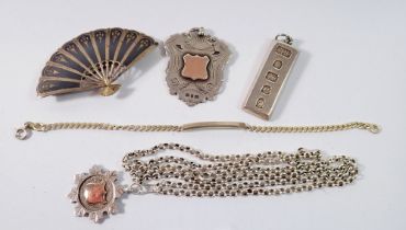 Two silver sports medals, silver ingot, identity bracelet and silver Siam brooch, 81g