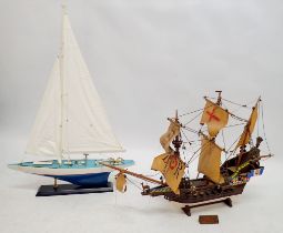 A vintage model ship of the Golden Hind, 80cm long and a model yacht