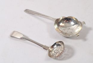 A silver tea strainer, Sheffield 1938 and a silver Georgian sifter spoon, 64g