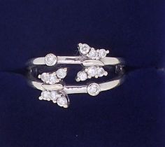 An 18ct white gold split shank ring with two diamond set butterflies, 4.9g, size N to O