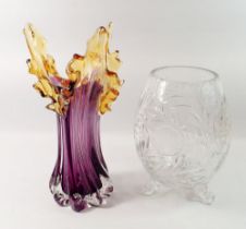 A large cut glass vase with star decoration and swirl tripod supports together with an art glass