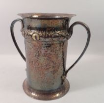 A silver plated Arts & Crafts hammered bottle holder