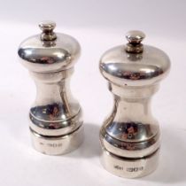 A pair of silver salt and pepper grinders, London 1995 & 1996, John Bull Ltd.