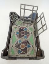 A group of antique stained glass window panels