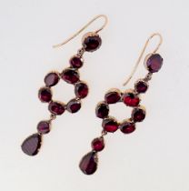 A pair of antique garnet set gold pendant earrings of circle and drop form, 5cm long,
