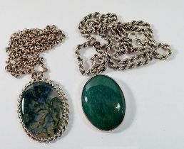 Two stone set silver pendants and chains