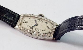 A platinum set Art Deco cocktail watch with sapphire set bezel