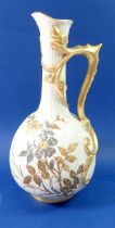 A Victorian Royal Worcester large ivory and gilt jug with trailed stem and leaf handle, painted gilt