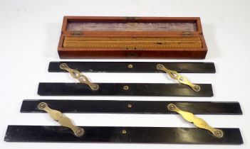 A box of six wooden rulers by W Harling plus two Naval ebonies parallel rulers