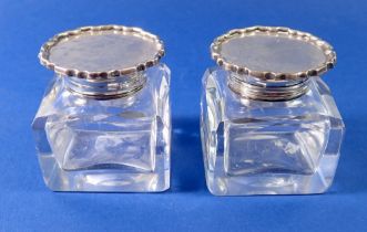 Two cut glass inkwells with silver lids and collars, London 1902, base 5.5cm square x 6cm tall