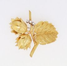 An 18 carat gold Copp & Farr nut and leaf brooch set three diamonds, marked C&F, 22.5g, 4.5 x 4cm