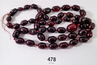 A long cherry amber bead necklace, 105cm long