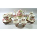A Royal Albert 'Blossom Time' tea service comprising teapot, eight cups and saucers, milk jug, six