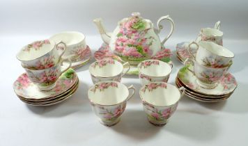 A Royal Albert 'Blossom Time' tea service comprising teapot, eight cups and saucers, milk jug, six