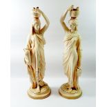 A pair of Victorian Royal Worcester large blush ivory figures of Grecian water carriers, date code