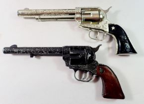 Two toy revolvers and fake bullets - Rustler 45 and Lone Star Range Rider MK II