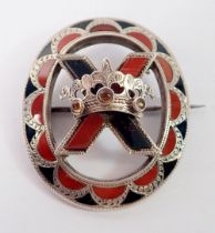 A Scottish stone set Celtic silver brooch with coronet, 4.5 x 4cm