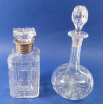 A silver plated and cut glass spirit decanter, 30cm and an Edwardian decanter, 22cm